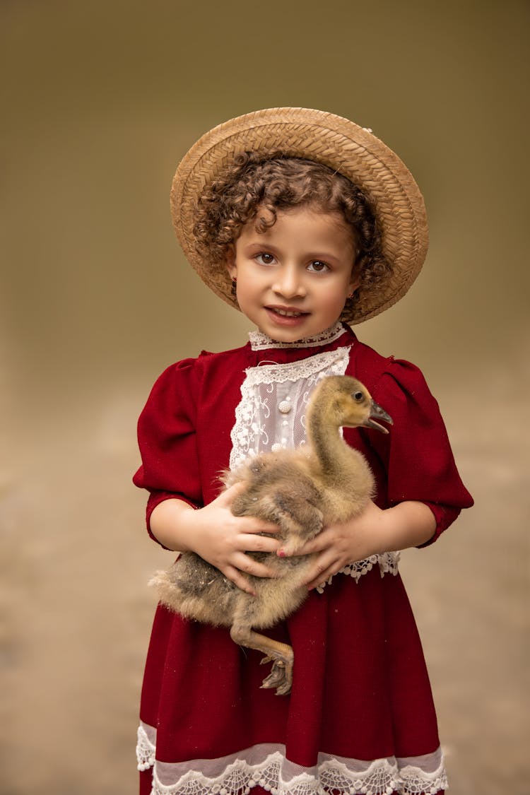 Portrait Of Girl Holding Duck