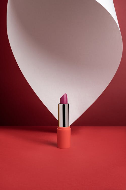 Luxurious Lipstick on Red Background