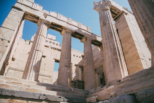 Cultural heritage of ancient Greek architecture with stunning columns under a clear blue sky.