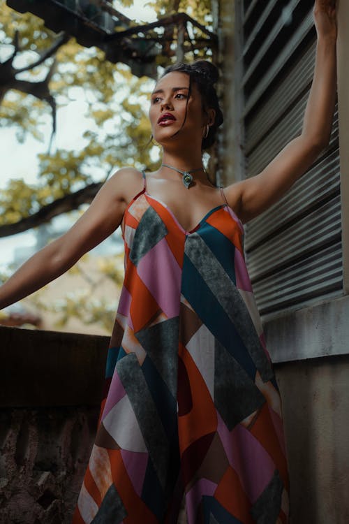 Woman Posing in a Dress with a Geometric Pattern