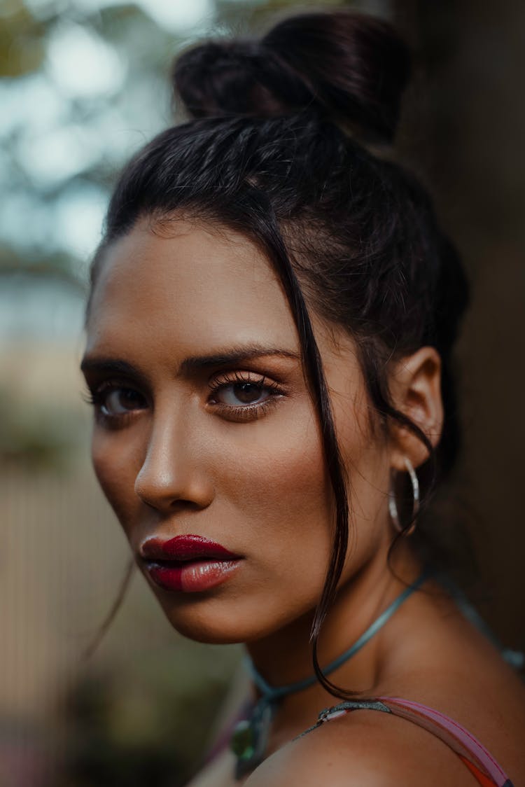 Woman In Makeup With Her Hair In An Updo