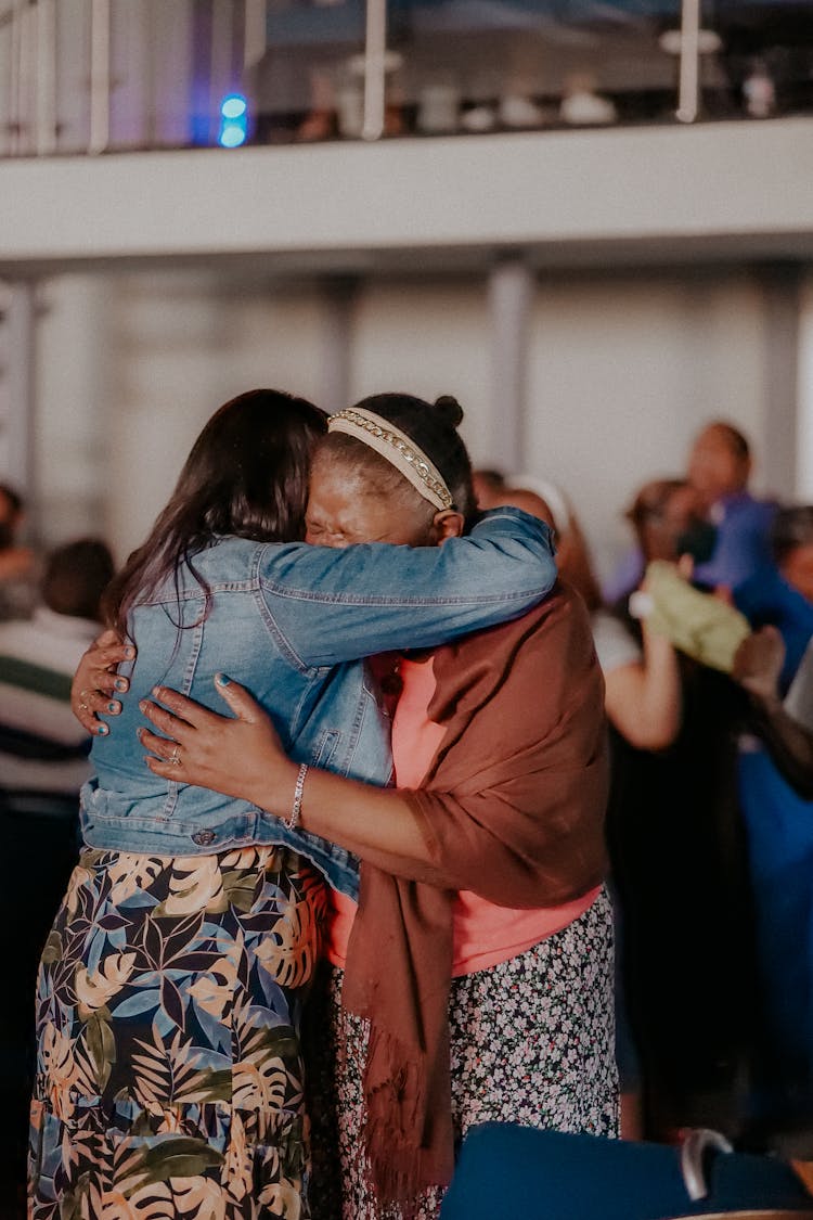 Woman Family Members Hugging On Airport