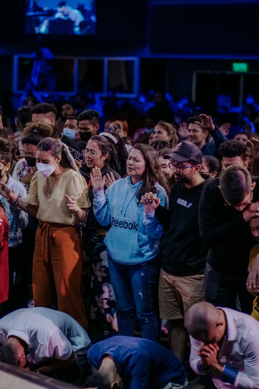 Congregation holding hands in prayer