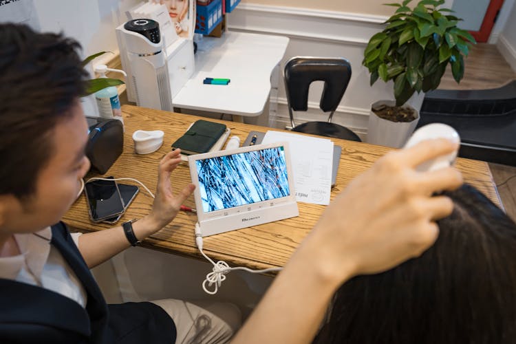 Man Watching On A Tablet