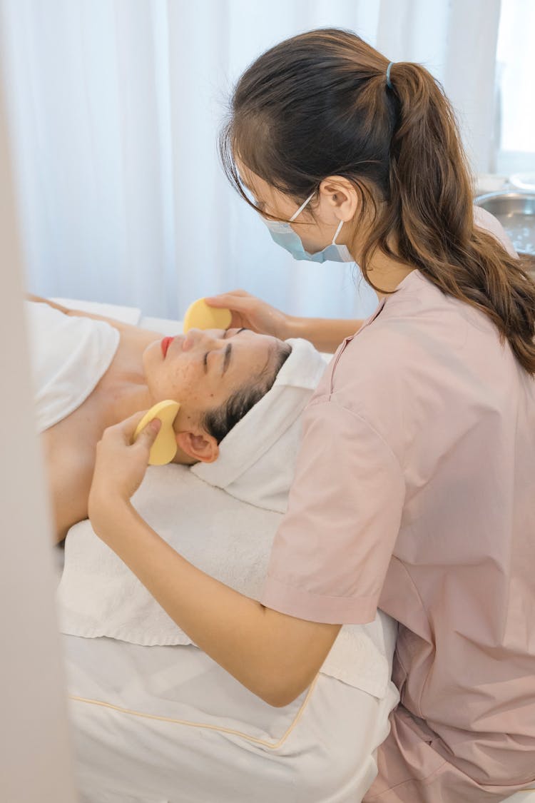 A Woman Having A Face Massage Session 