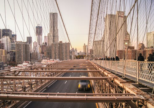 Vehicle Passing Bridge Near Building