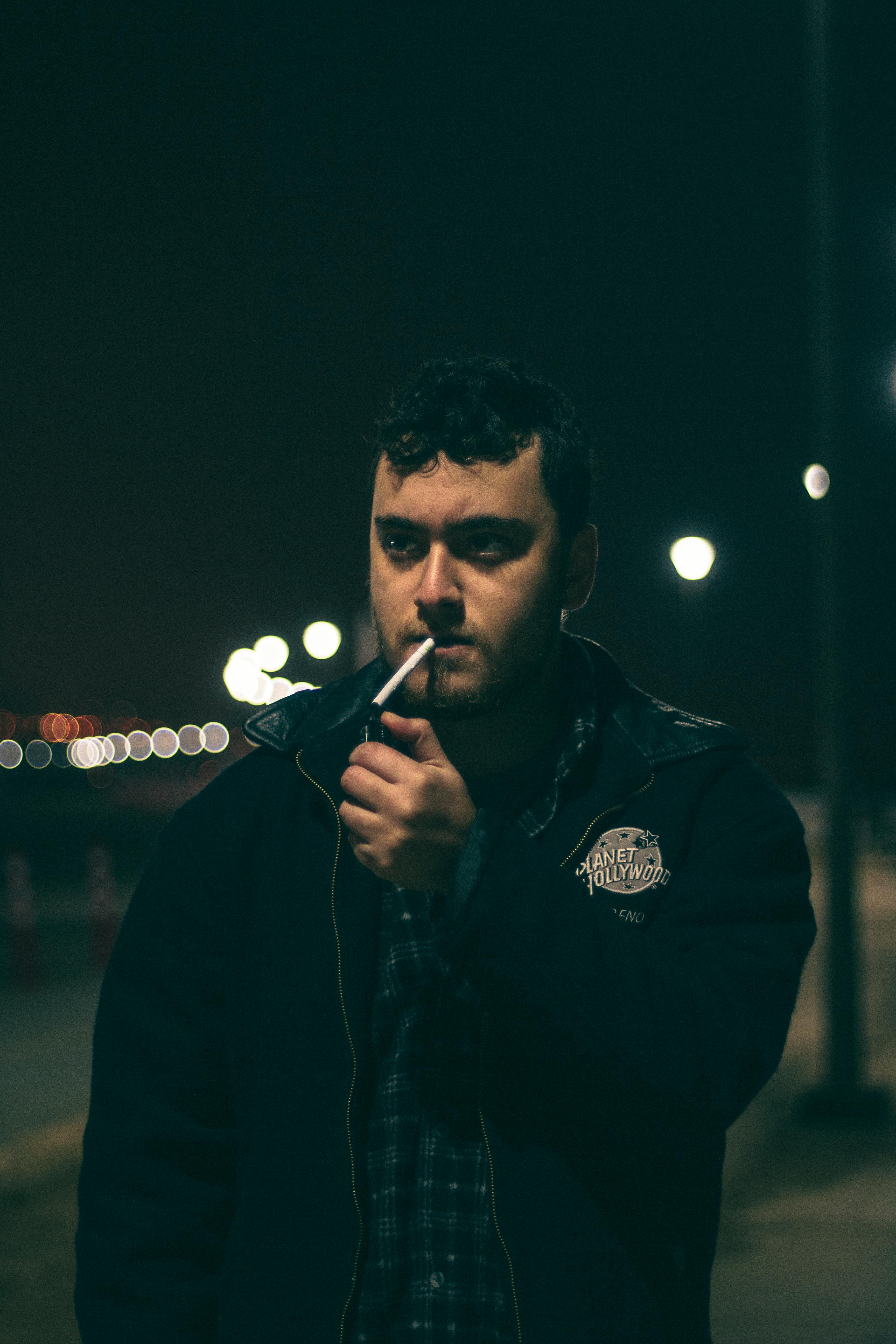 Man Lighting a Cigarette · Free Stock Photo