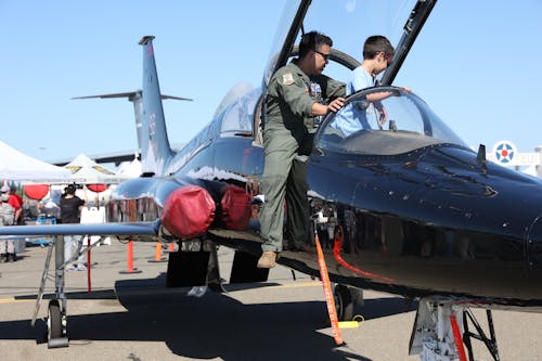 Pilot Letting a Child Sit in a Jet 