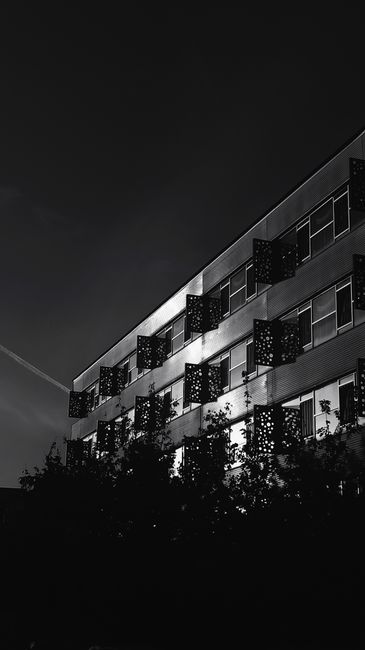 Low angle black and white shot of a building facade in Üsküdar, Istanbul.
