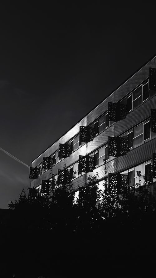 Free Low angle black and white shot of a building facade in Üsküdar, Istanbul. Stock Photo
