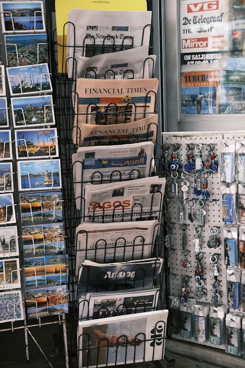 Newspaper Rack with Papers and Postcards
