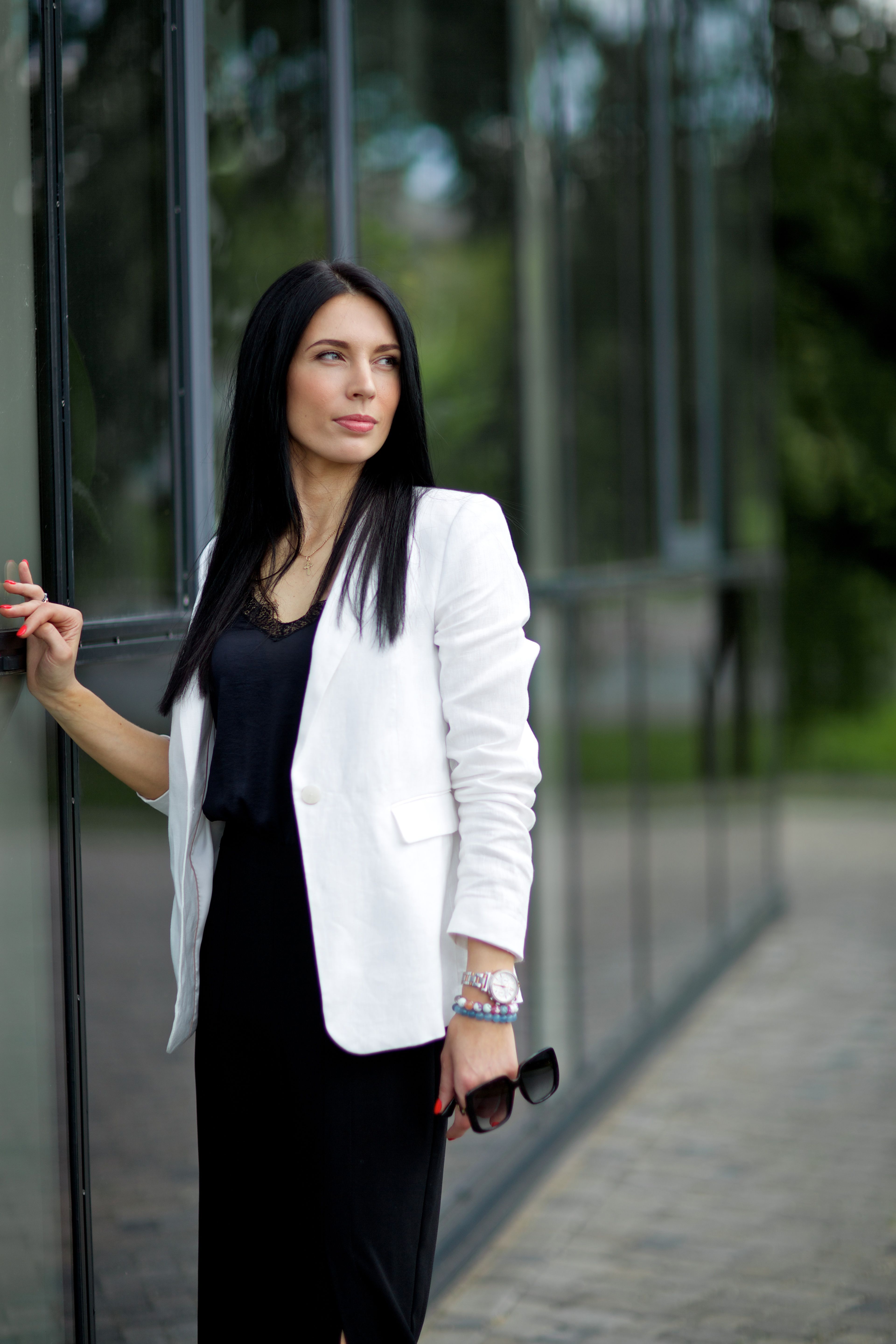 Woman in White Blazer Standing Beside the Glass Wall · Free Stock Photo
