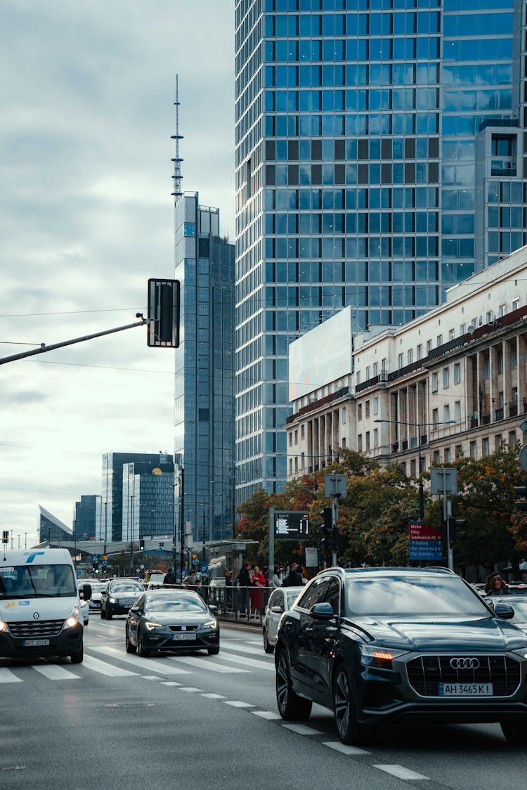 Cars On Road Near High Rise Buildings