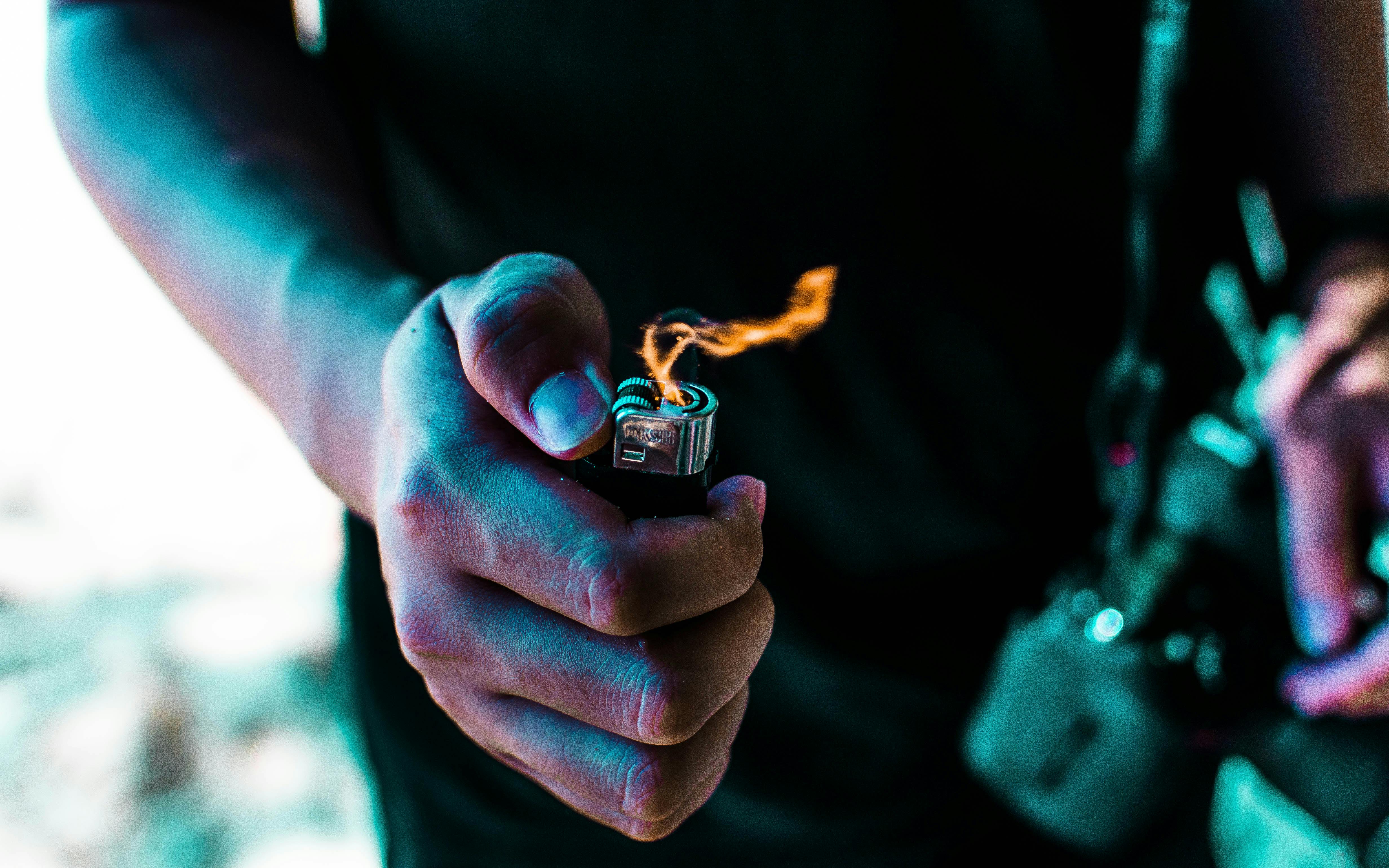 Person Holding Lighted Lighter · Free Stock Photo