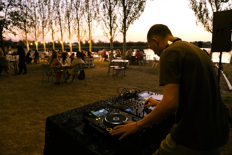 A DJ At An Outdoor Party