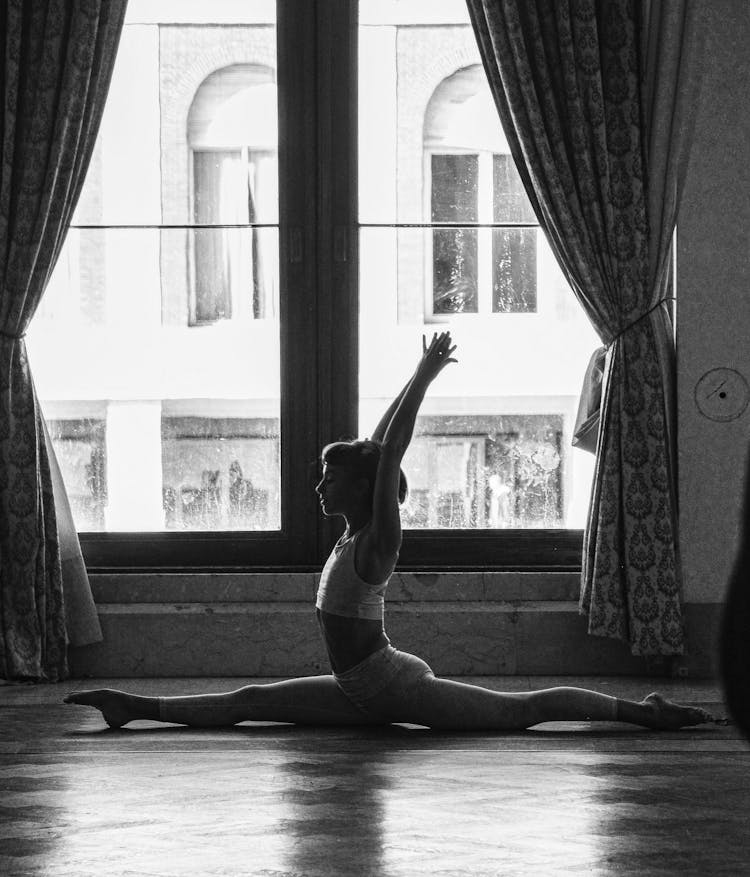 Woman Doing Splits During Yoga Exercise