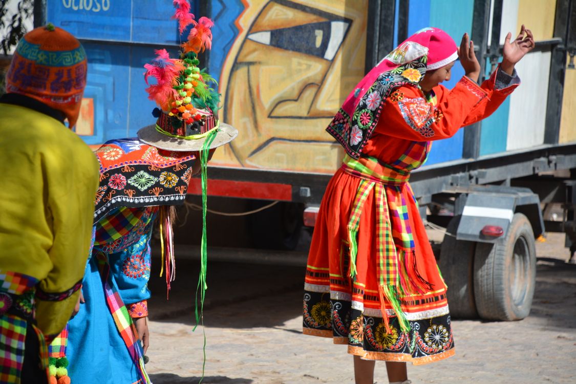 Pollerin Women in Traditional Clothing Dancing in the Street · Free Stock Photo