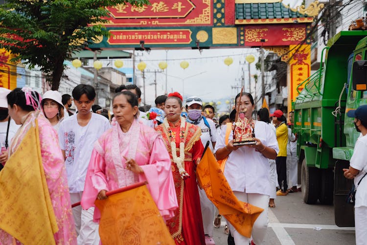 People In Traditional Costumes On City Festival