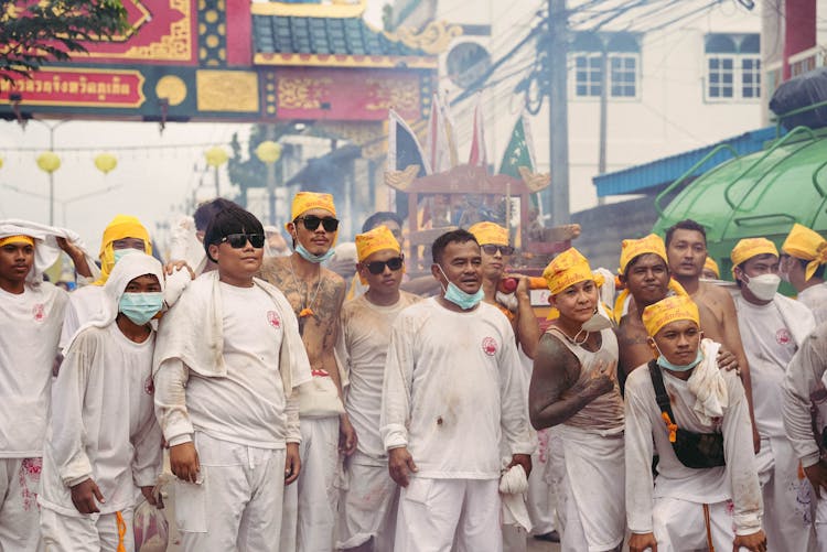 Men In White Clothes On City Street Festival