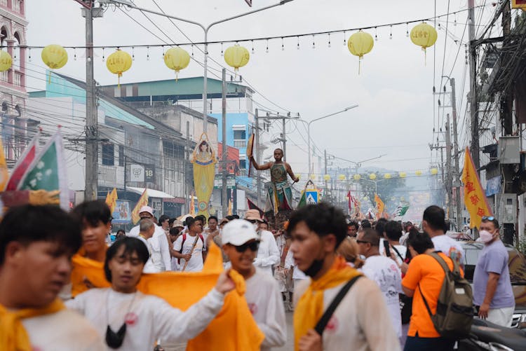 People Celebrating On Street On City Festival 