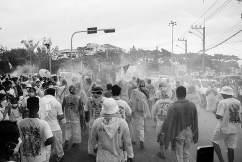 Free A bustling street festival in black and white with a large group of people celebrating. Stock Photo