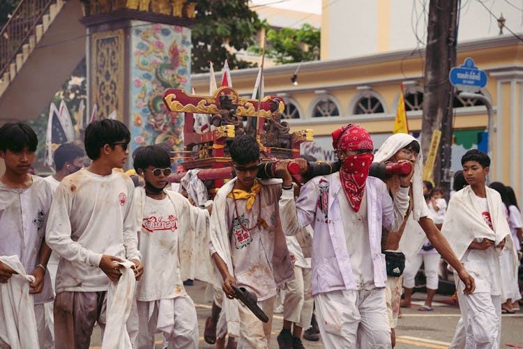 Men Carrying Statue During City Festival