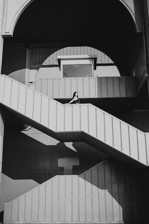 Woman Standing on Staircase