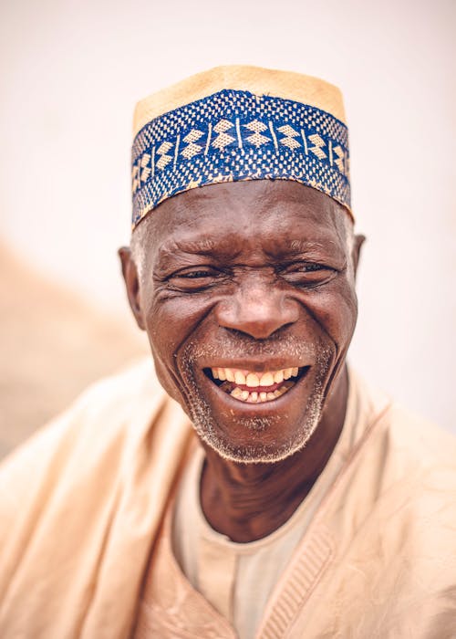 Free Smiling Elderly Man Wearing a Traditional Hat  Stock Photo