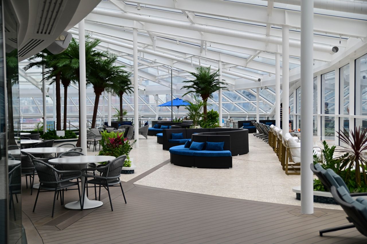 bright indoor leisure area featuring stylish seating glass roof and lu