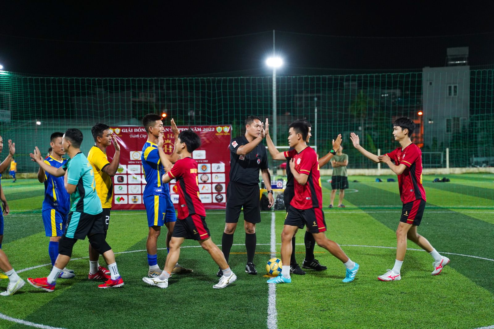 Players greeting each other after a football match