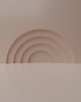 A modern minimalist beige abstract background featuring a series of concentric arches creating a stylish and soft aesthetic.