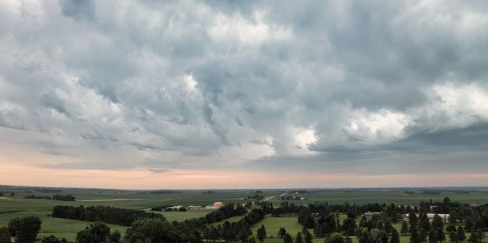 Expansive rural landscape in Plainview, Minnesota under dramatic skies.