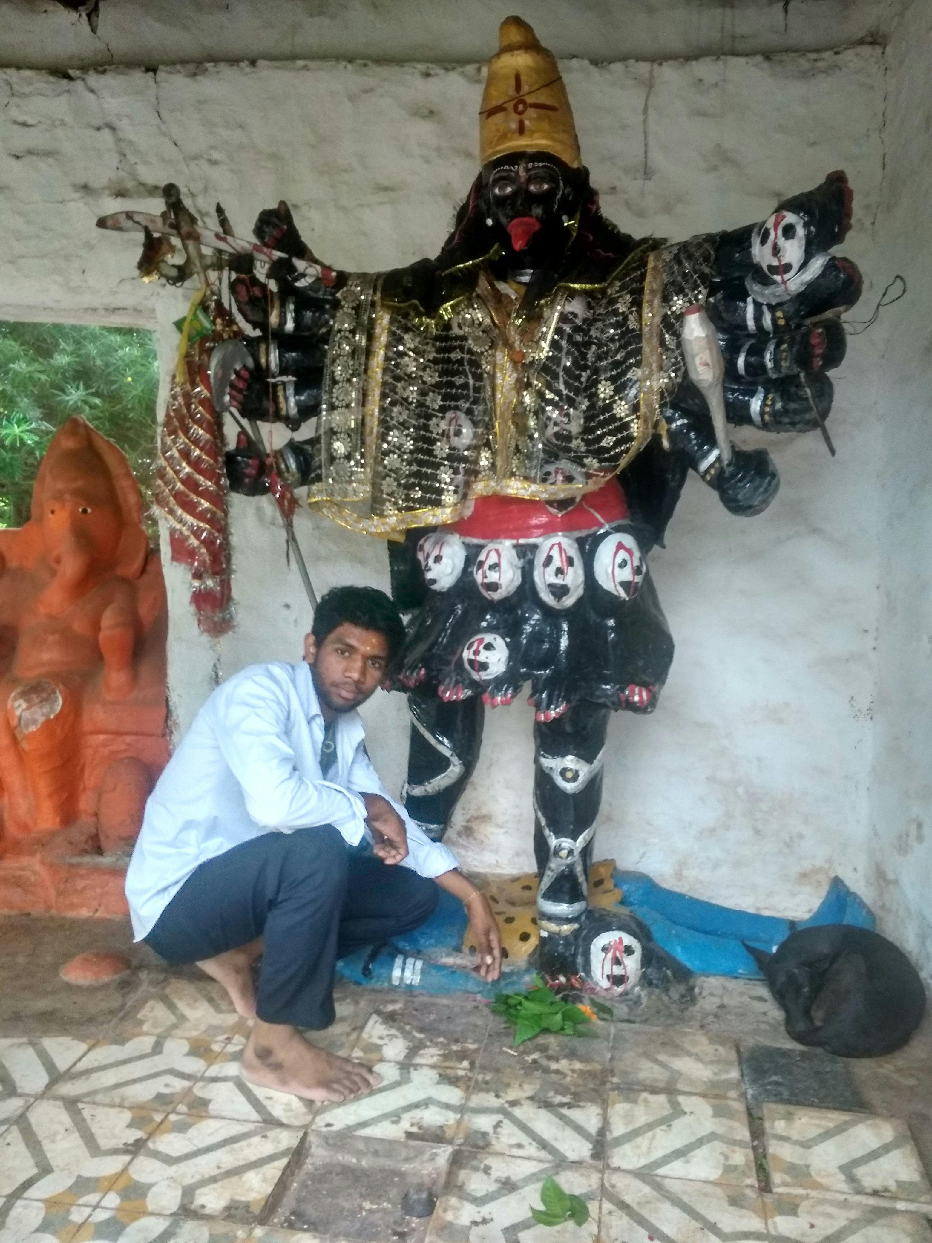 Traveler in an airplane seat wearing a mask and using hand sanitizer