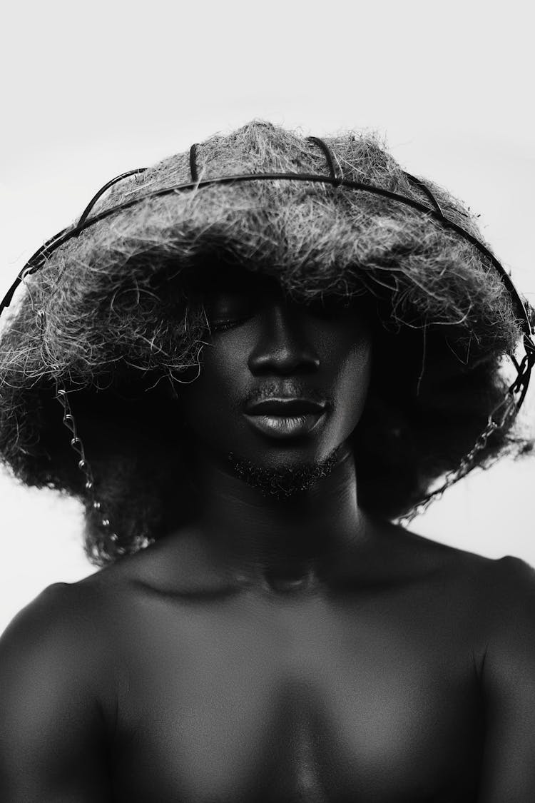 Man Wearing A Basket On His Head 