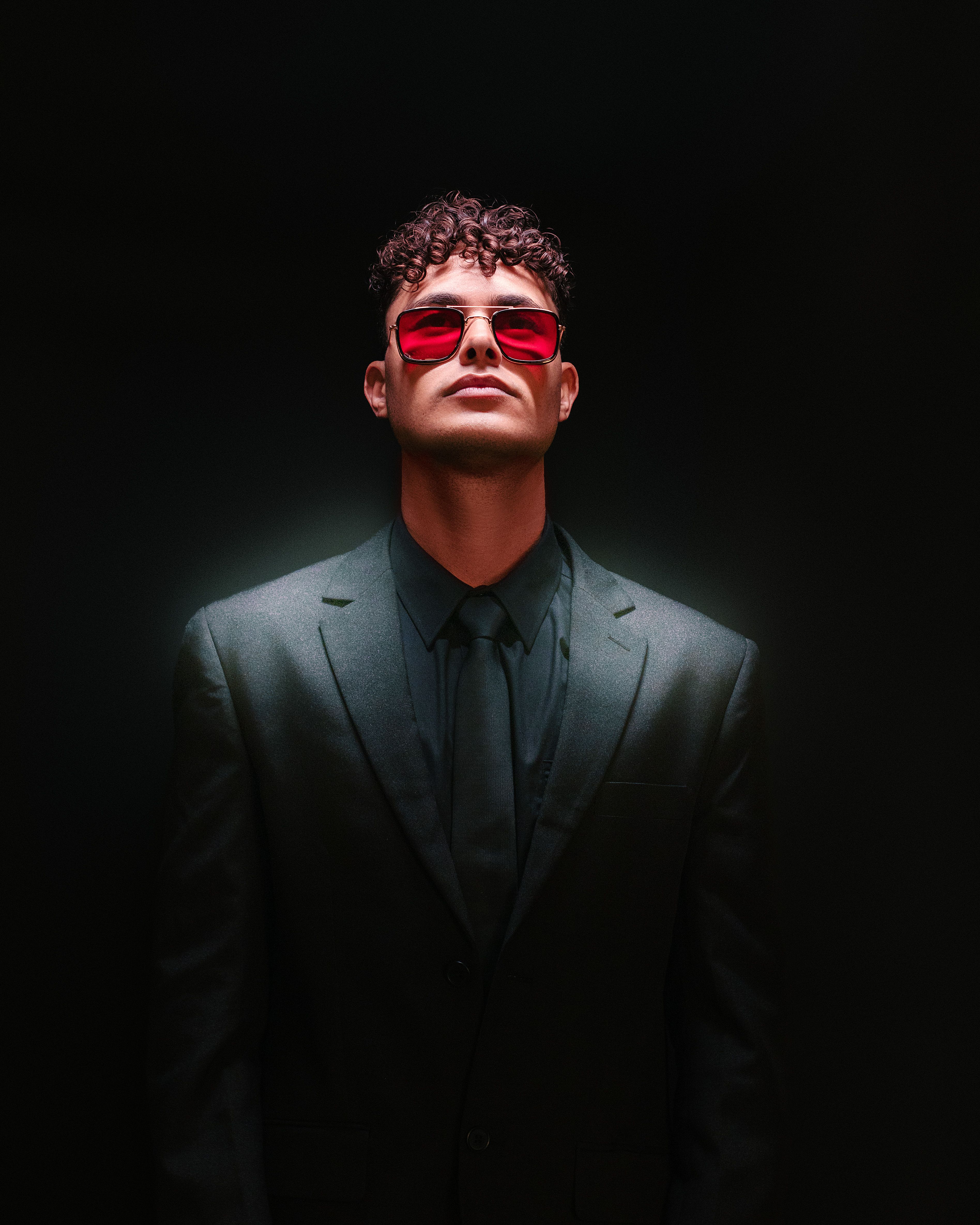 A Man in a Black Suit Wearing Red Sunglasses · Free Stock Photo