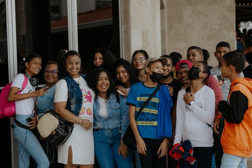 Free Diverse group of teenagers enjoying time together, smiling and posing for a photo. Stock Photo