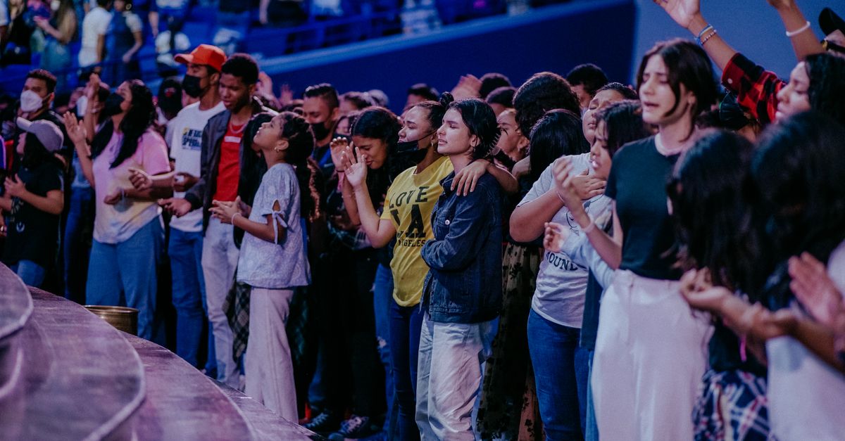 Christ Embassy Loveworld Arena Ho evening fellowship attendees praying together
