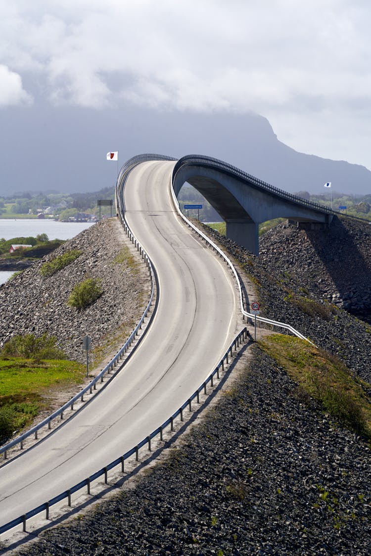 Road Above Water In Mountains Landscape