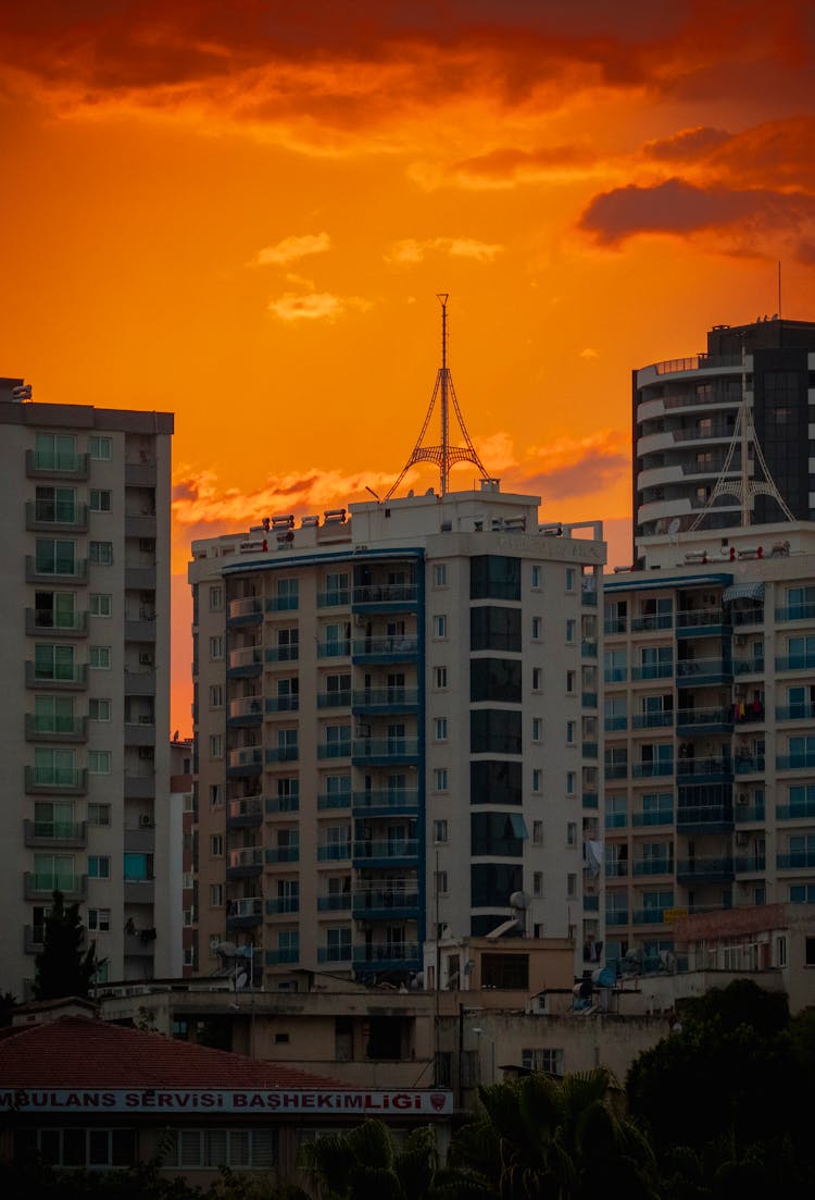 Dramatic Orange Sunset Above Residential Buildings