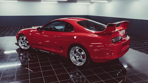 Red Shiny Car Inside a Garage