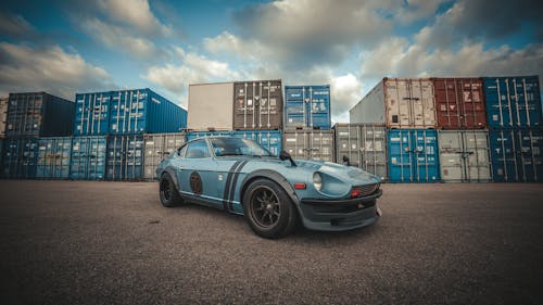 Datsun 280Z Parked on the Background of Containers in a Port 