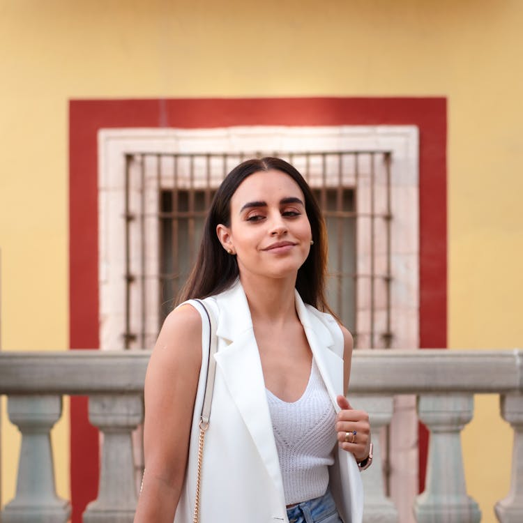 Woman In White Top And Vest