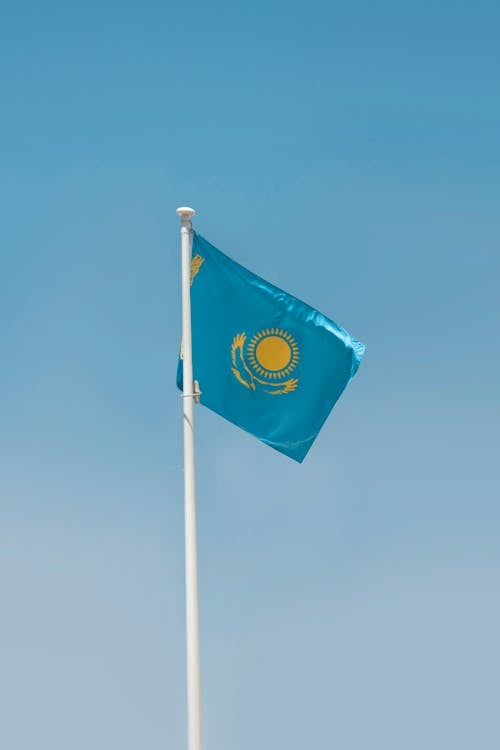 Kazakhstan National Flag Under Blue Sky