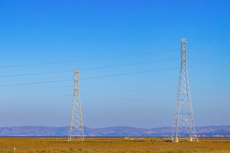 Electric Towers Under The Blue Sky