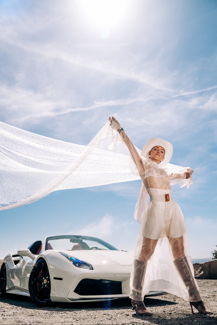 Woman In Tulle Costume Posing Near Modern Sport Car