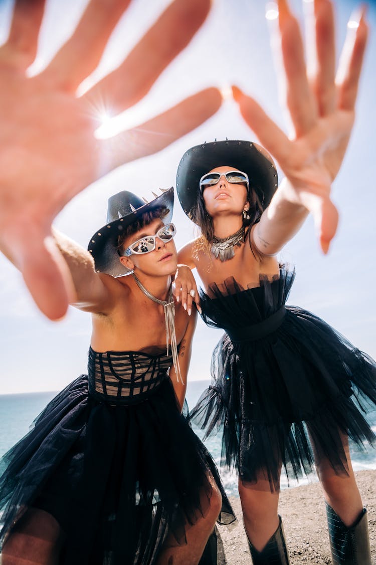 Models In Tulle Black Dresses Posing On Beach