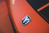 Emblem on the Front of an Orange Dodge Challenger
