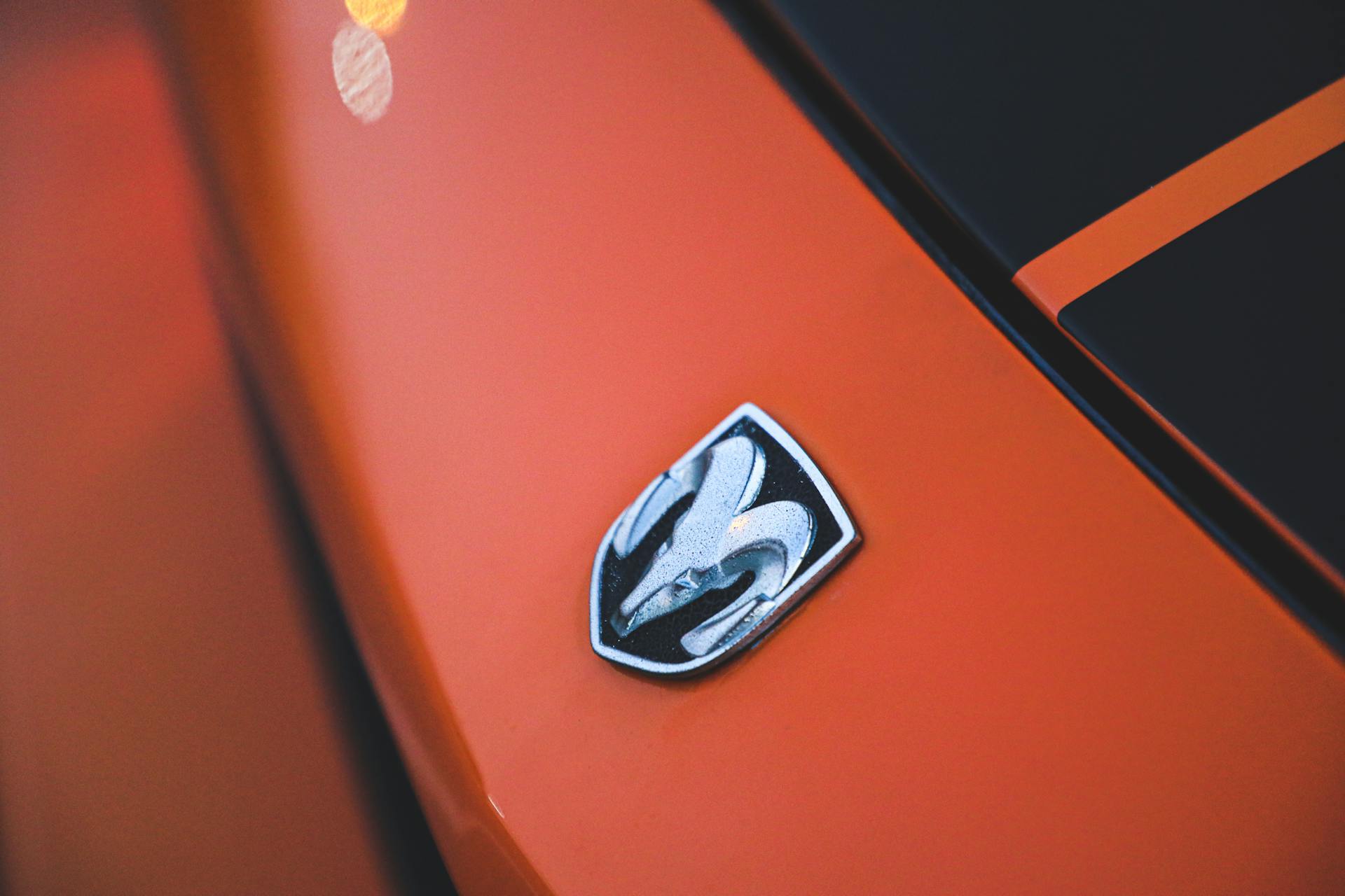 Emblem on the Front of an Orange Dodge Challenger