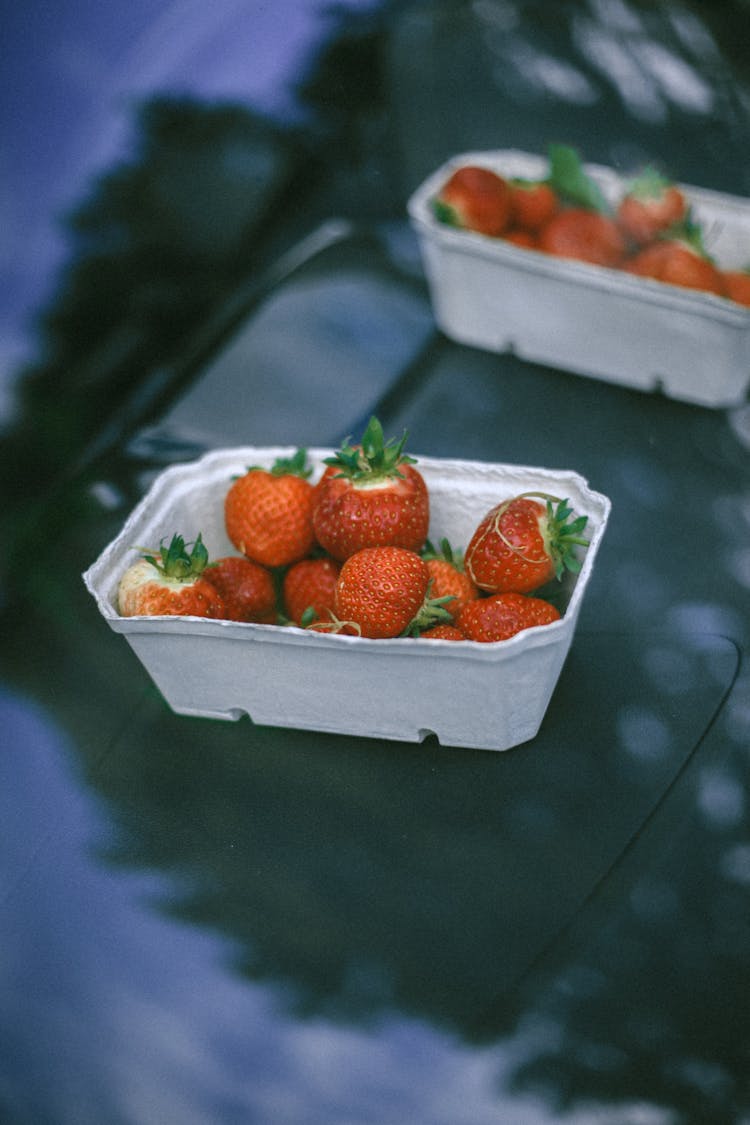 A Fresh Strawberries On White Container