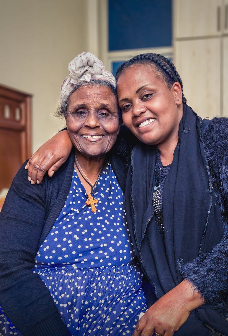 An Elderly Woman And Her Granddaughter